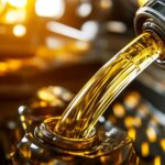 Fresh marine engine oil being poured from a bottle into the oil fill port of an inboard boat engine